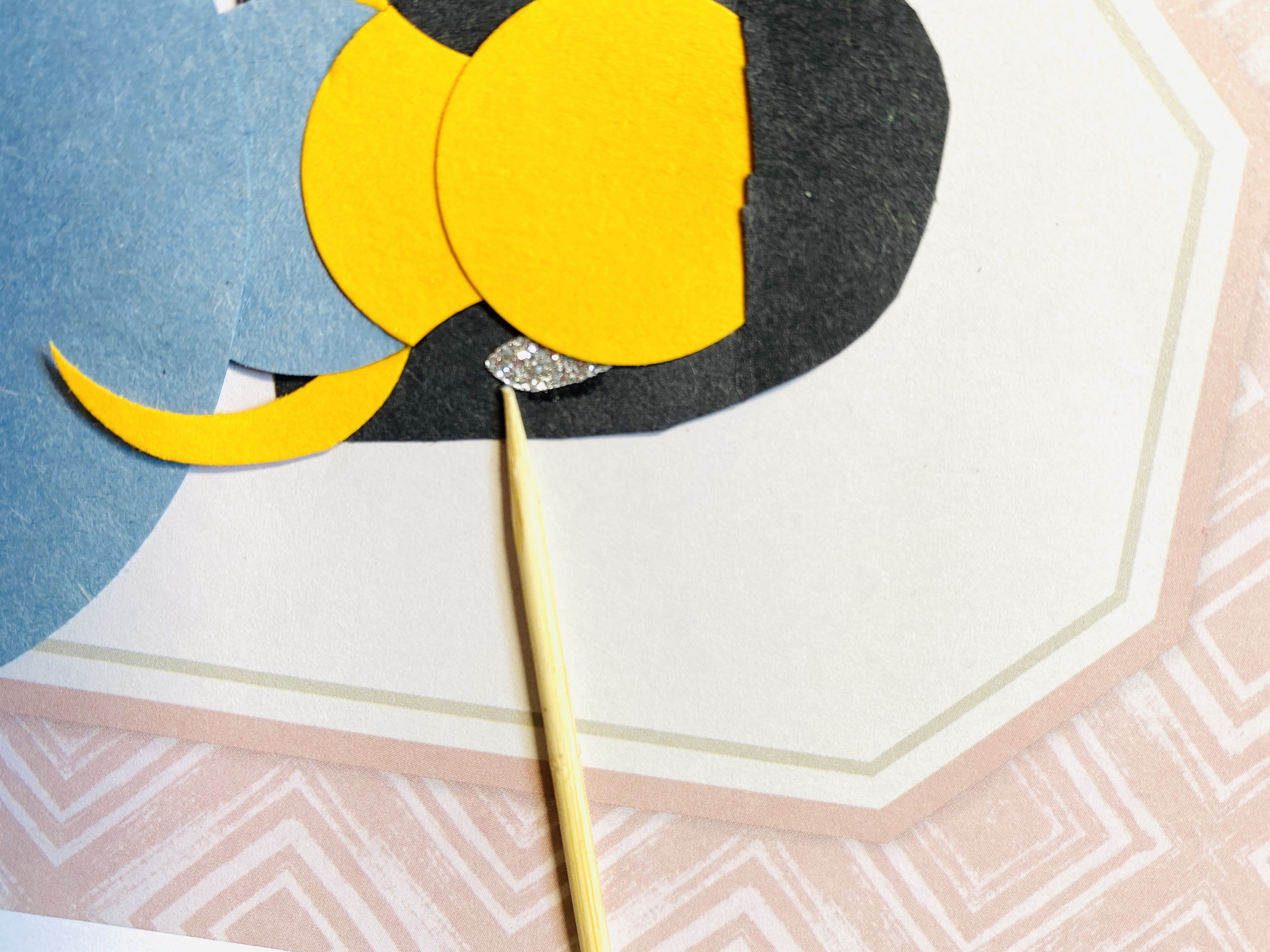 Adding the earring to the paper princess card