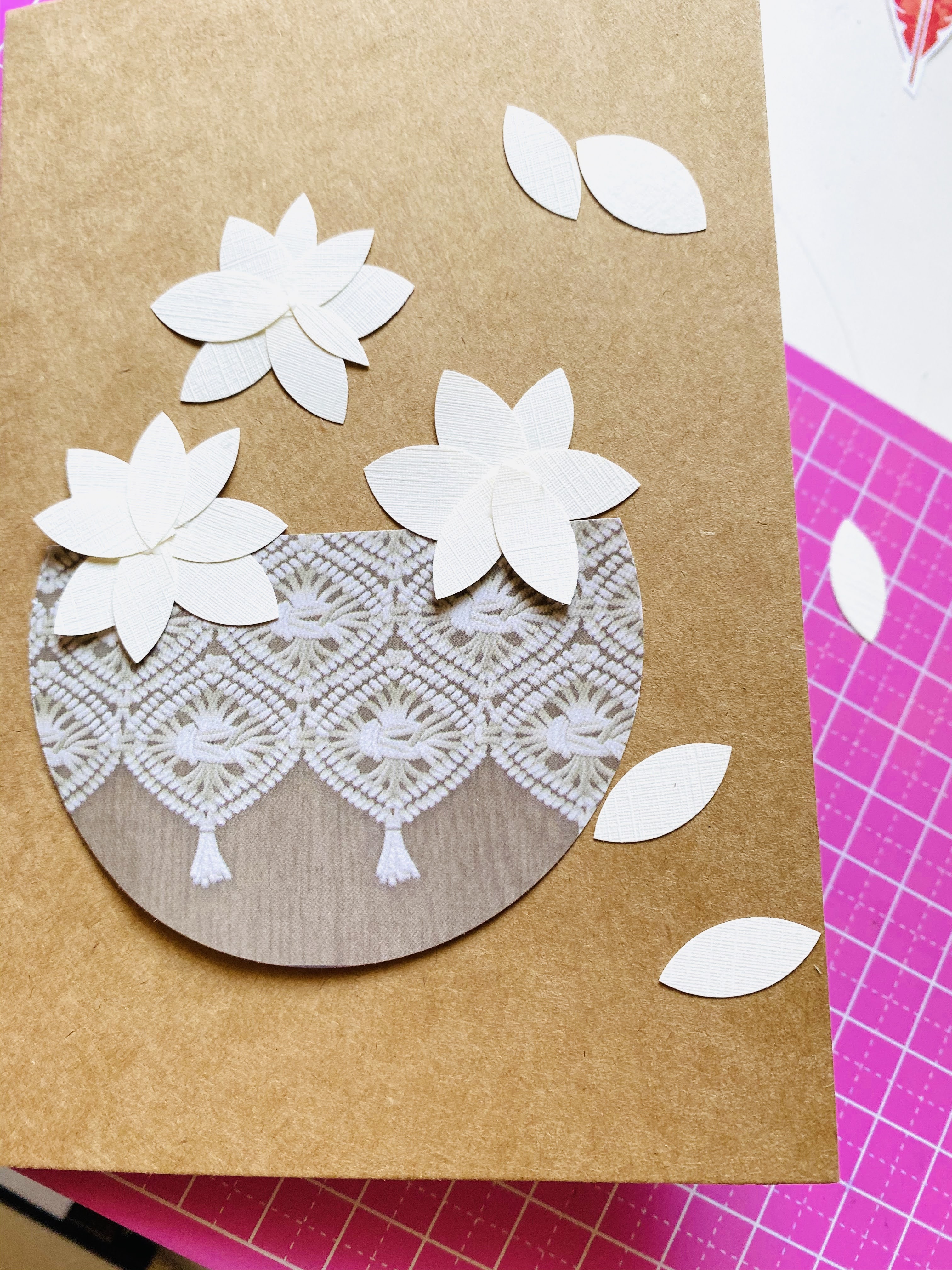 Forming magnolia flowers out of textured paper and making a flower basket for a homemade card.