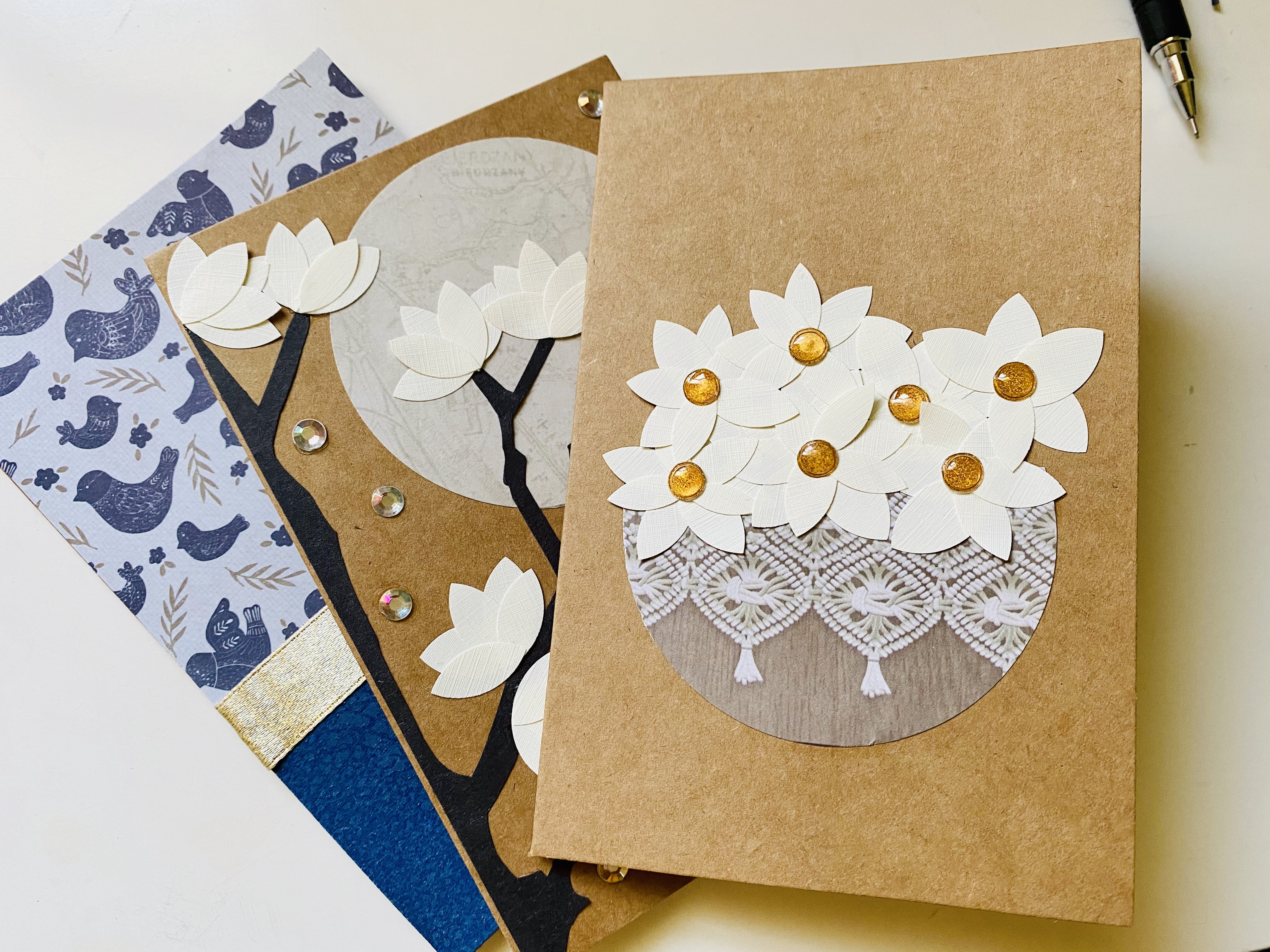 Using textured resume paper or off-white textured paper to create flower petals for magnolia cards. 