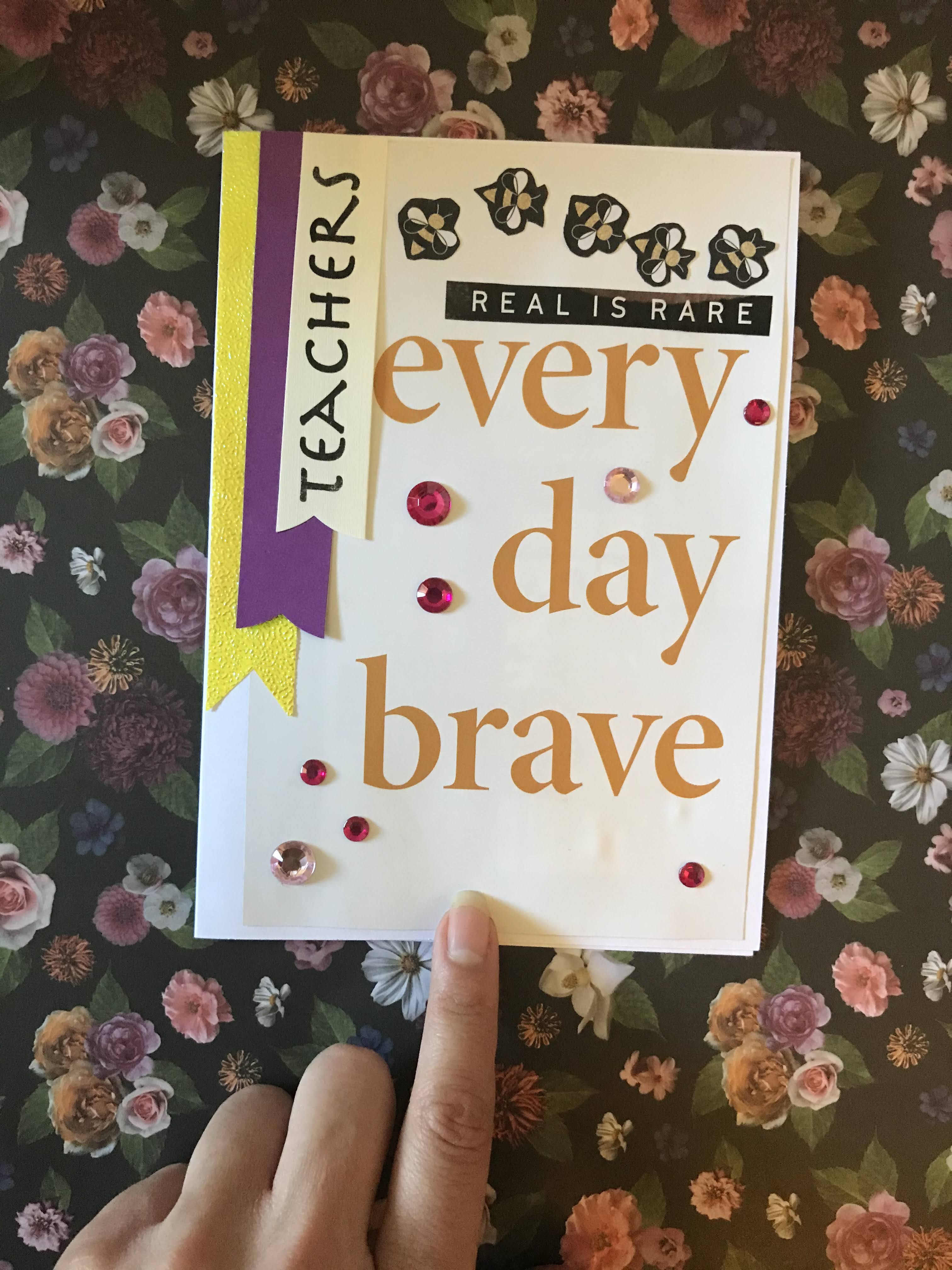 Front of card with "every day brave" phrase and banner lettering with gem stones